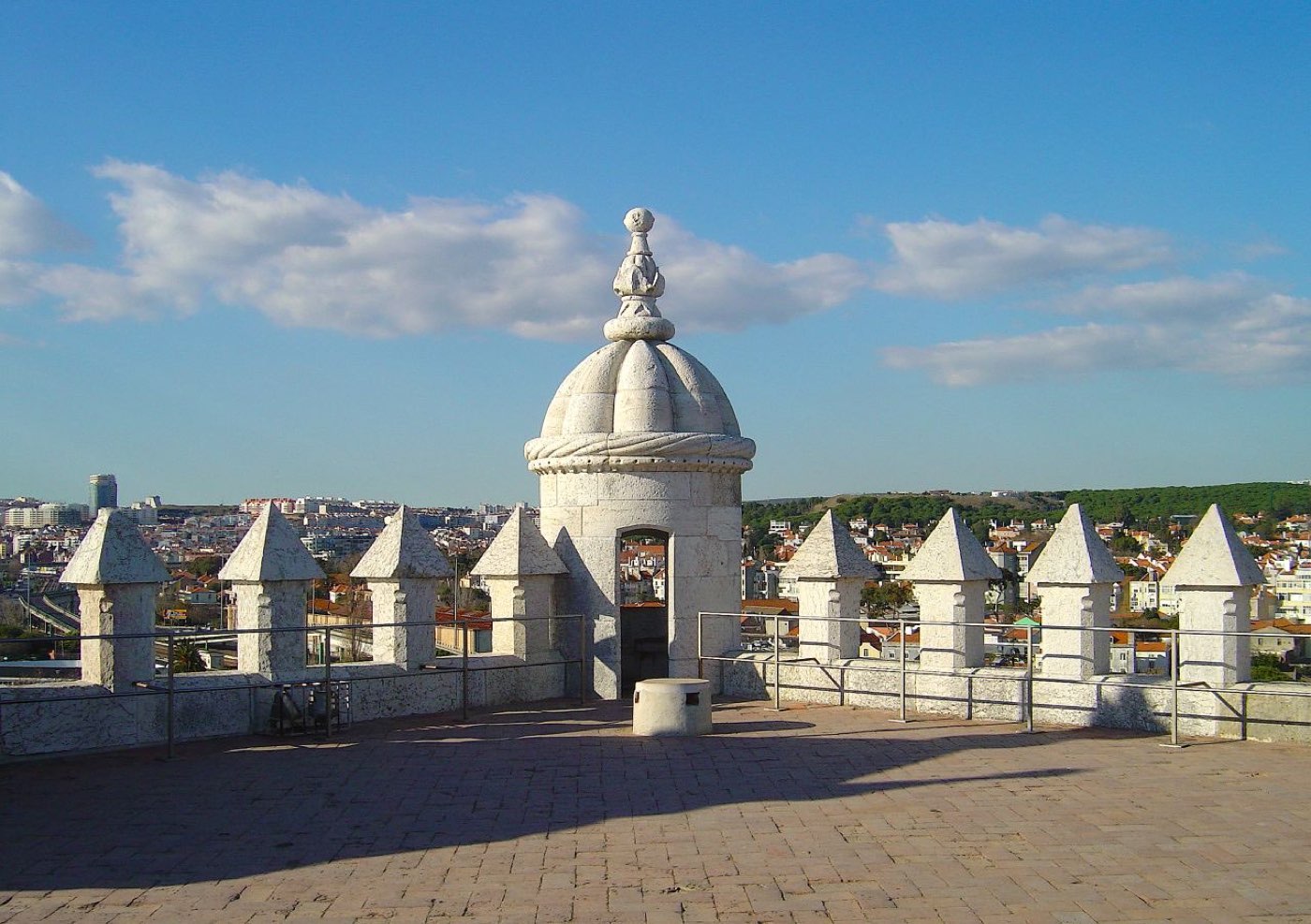 Belém Tower, a white limestone fortified tower standing in the River Tagus
