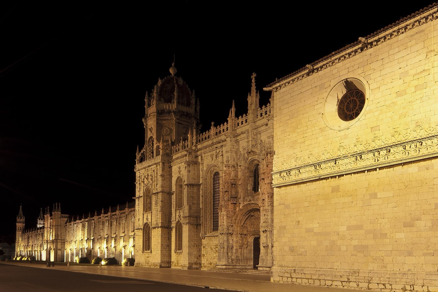 The long limestone facade of Jerónimos Monastery in Belém, Lisbon